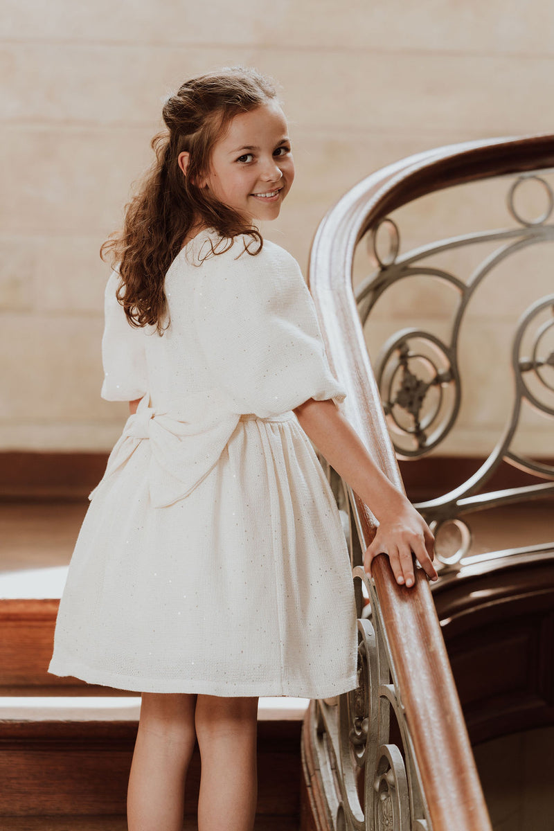 Feestjurk met strik en glitters