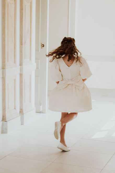 Feestjurk met strik en glitters