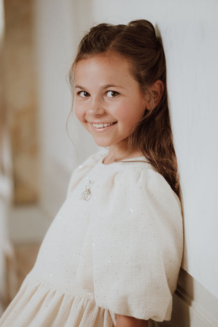 Feestjurk met strik en glitters