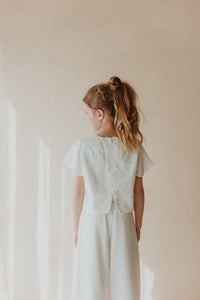 Robe blanche perlée festive avec sac assorti
